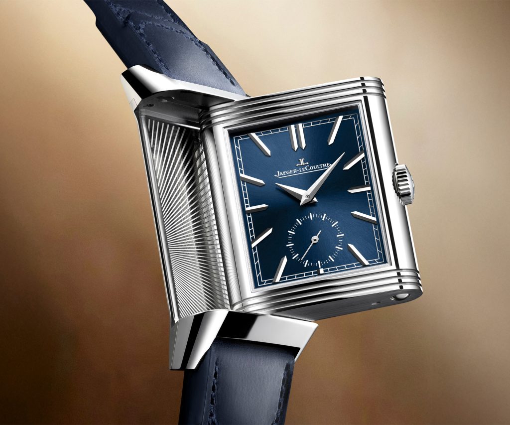 Front and back view of the blue Reverso Tribute Duoface Small Seconds showing the blue sunray lacquer front dial and silver sunray reverse dial with second time zone and 24-hour indicator.
