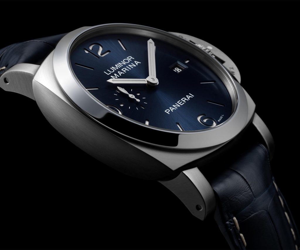 : Panerai Luminor Marina PAM03313 with 44mm brushed steel case, blue sun-brushed sandwich dial, white luminous markers, and polished bezel with brushed case.