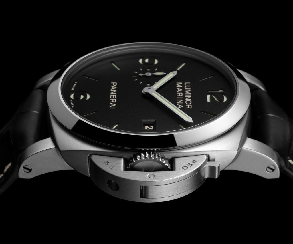 Panerai Luminor Marina PAM03312 with 44mm steel case, black matte sandwich dial, green Super-LumiNova® X2 Arabic numerals and hour markers, and date window at 3 o'clock.